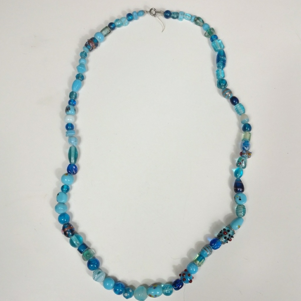 Vintage necklace of art glass beads in blue
